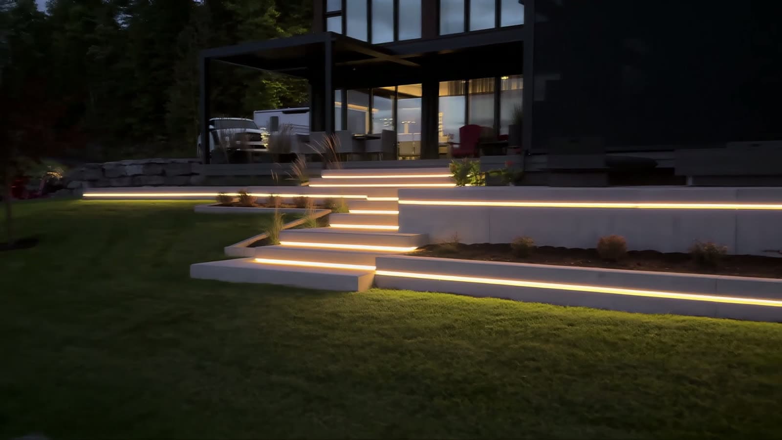 Tiered landscape lighting across steps, planters and grade changes